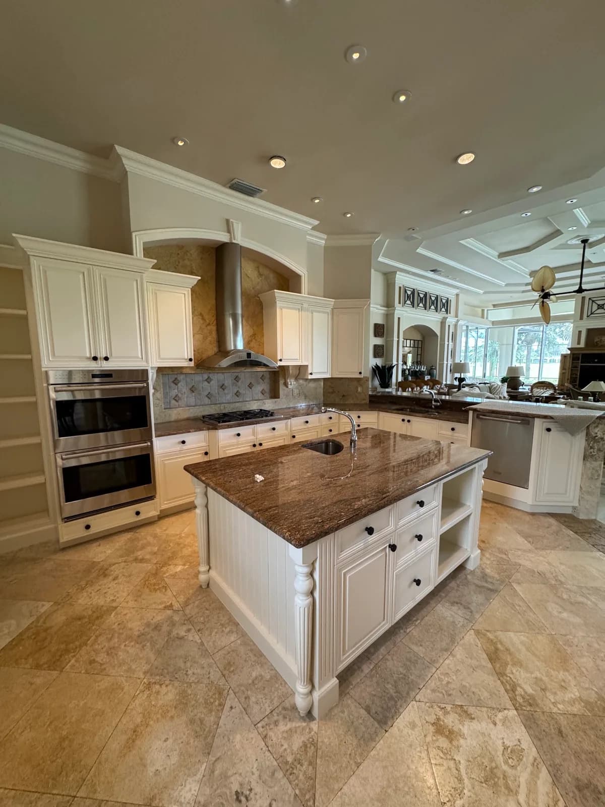 Refinished kitchen with a painted hood surround