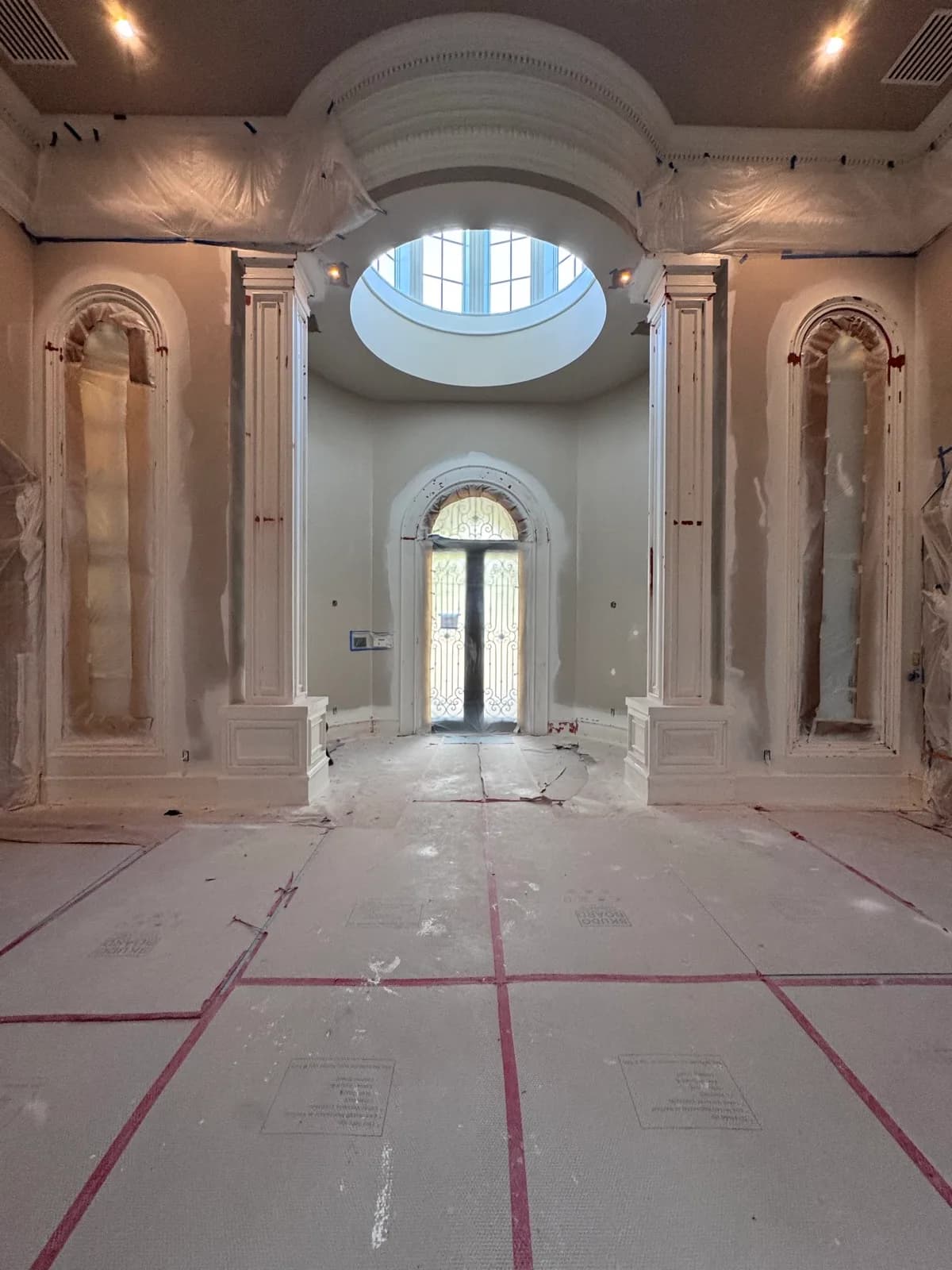 Rotunda with plaster columns part way through finishing