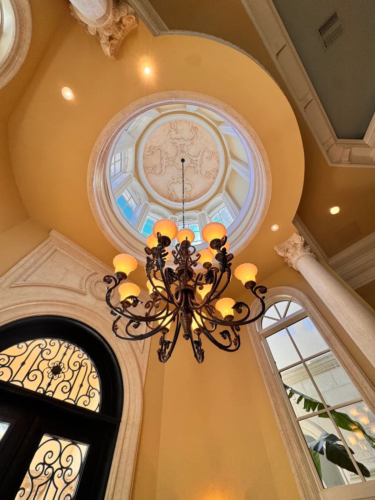 Stained-glass dome framed by hand-finished plaster