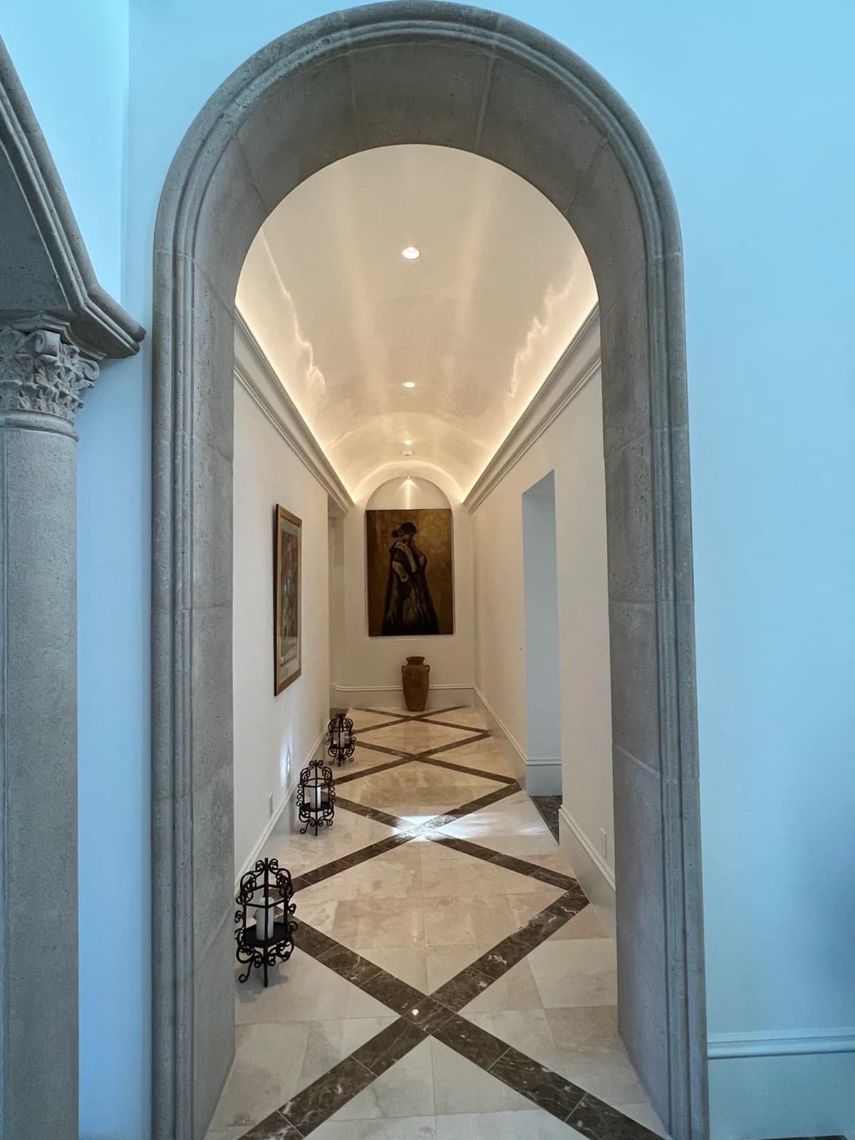 Plaster-vaulted hallway with inlaid stone floor detail