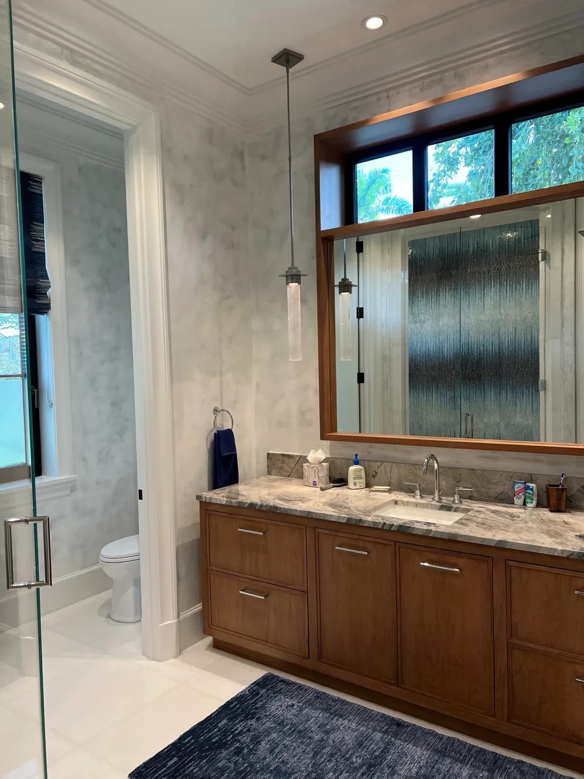 Venetian plaster walls around a timber bathroom vanity