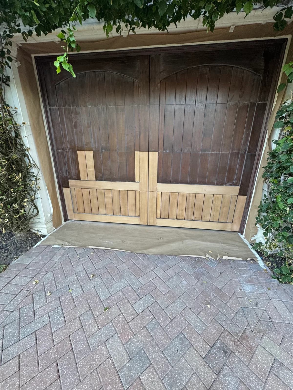 Timber garage door weathered by sun before refinishing