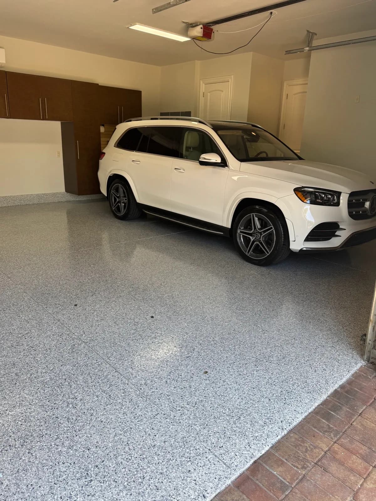 SUV parked on a completed flake epoxy garage floor