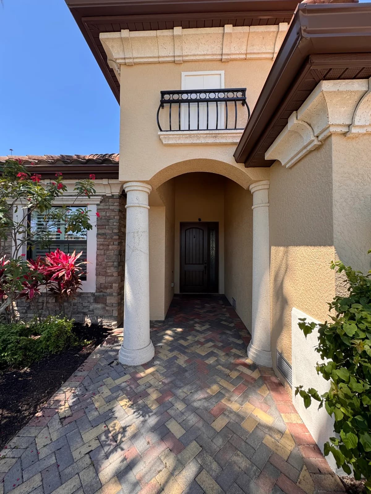 Painted entry columns framing a timber front door