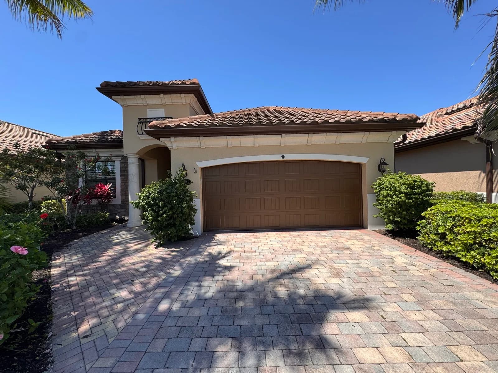 Repainted stucco home and paver driveway