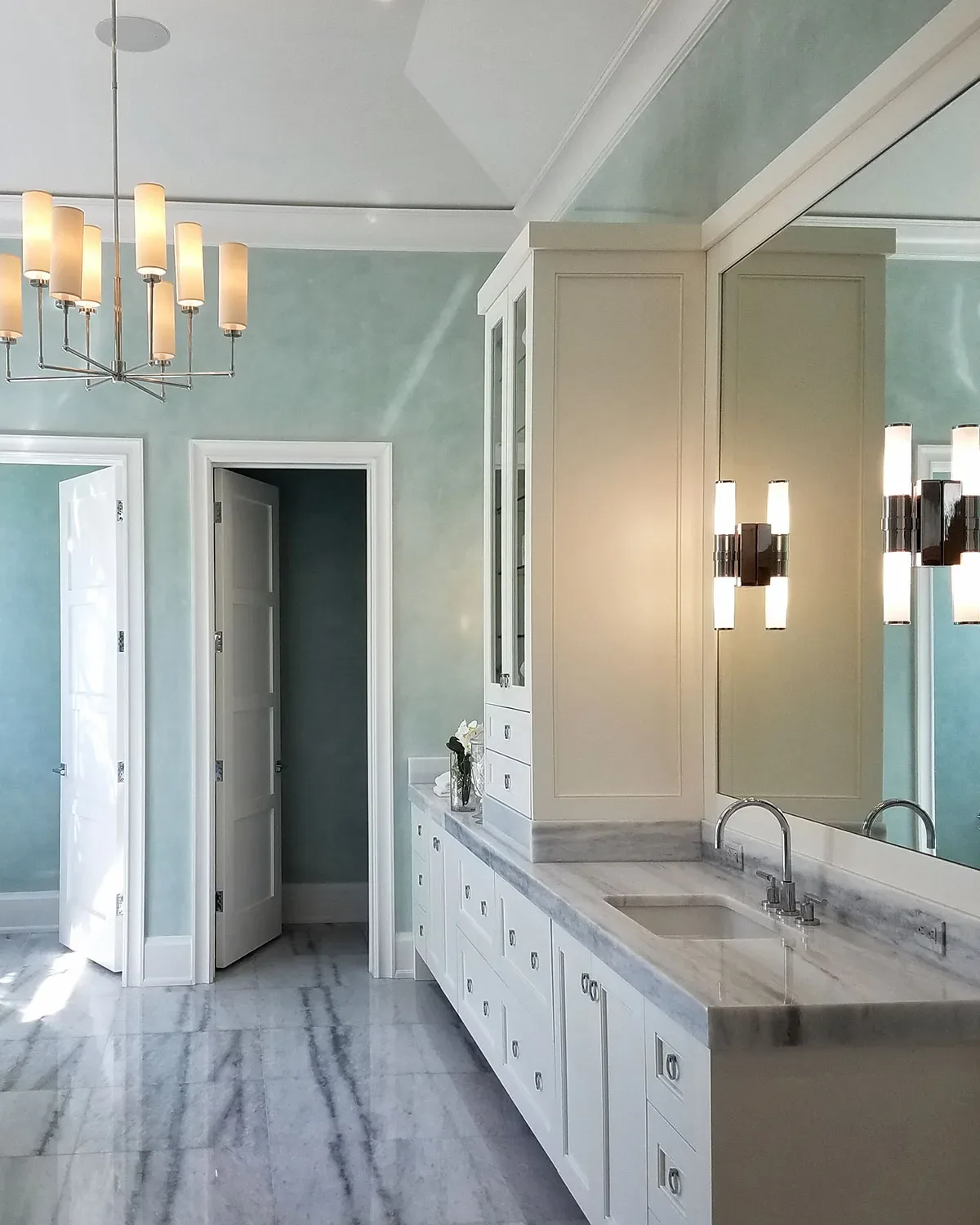 Bathroom with a hand-applied decorative wall finish in soft blue-green