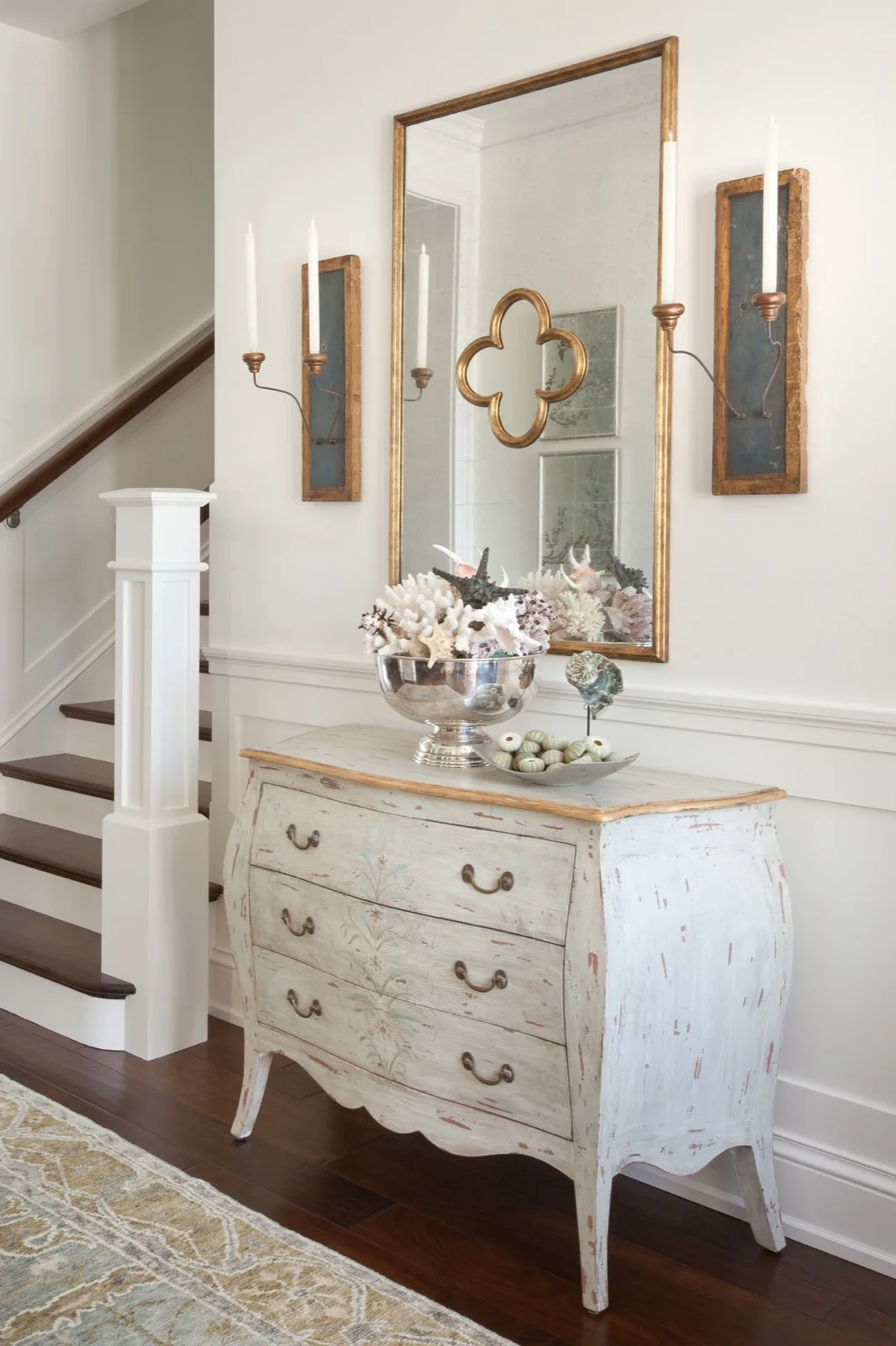 Entry hall with a painted console table beside the stair