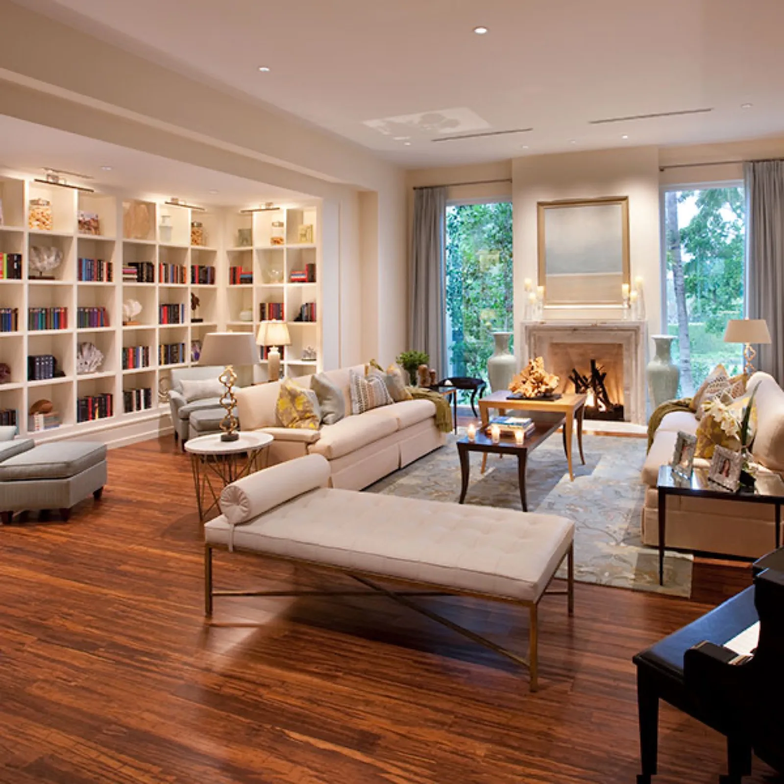 Library with painted shelving either side of a fireplace