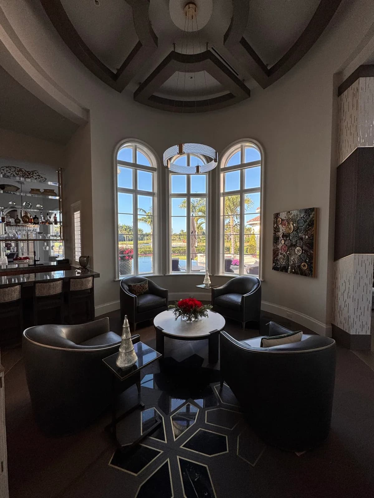 Sitting room with arched windows and painted millwork